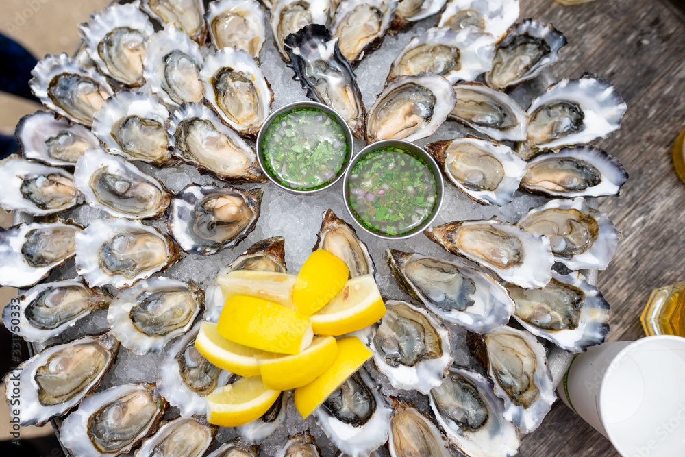 50 Oysters on a platter - with lemons and vinaigrette 50 Oysters on a platter - with lemons and vinaigrette