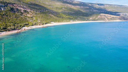 Beautiful beaches with transparent waters in Arrábida, in Setúbal, Portugal. Creiro beach photo