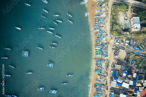 фотографія Aerial top view of fishing harbour with many traditional fisherman boats in Kerala, India