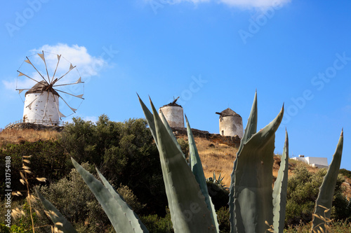 Fotografie, Obraz Vivlos, Naxos / Greece - August 25, 2014: Traditional windmill at the mountain v