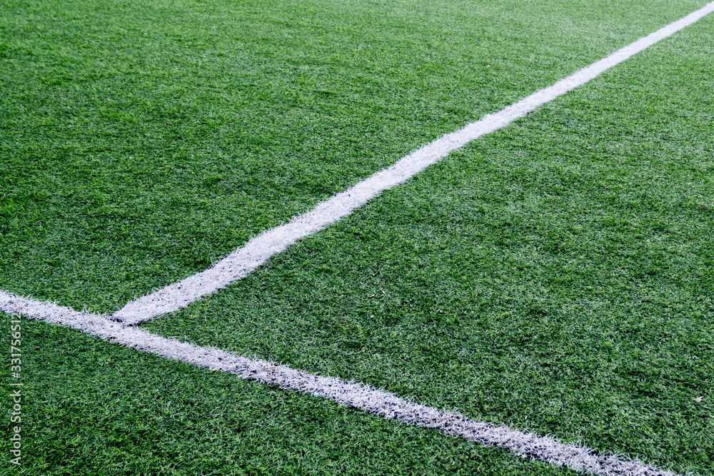 white stripes of marking on a green soccer field white stripes of marking on a green soccer field