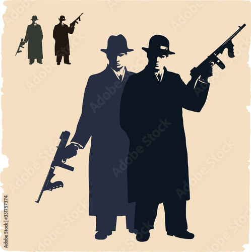 Two dark silhouettes of  gangsters. photo