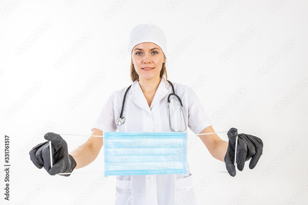 Young female doctor giving single use protective mask. Young female doctor giving single use protective mask.