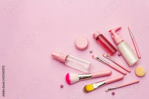 Makeup cosmetic set on pink background