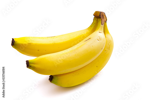 a bright yellow ripe banana isolated from a white background and copy space
