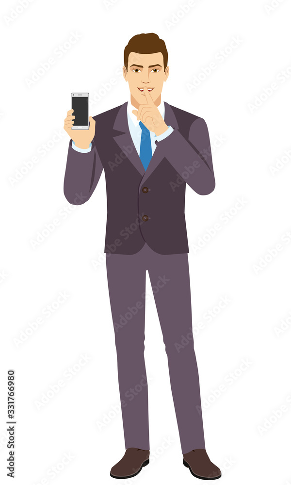 Hush hush. Smiling Businessman holding mobile phone and shows hush-hush sign. Full length portrait of Businessman in a flat style. Hush hush. Smiling Businessman holding mobile phone and shows hush-hush sign. Full length portrait of Businessman in a flat style.