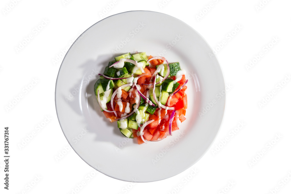 Spring salad of cucumbers, tomato, onions and sauce Spring salad of cucumbers, tomato, onions and sauce