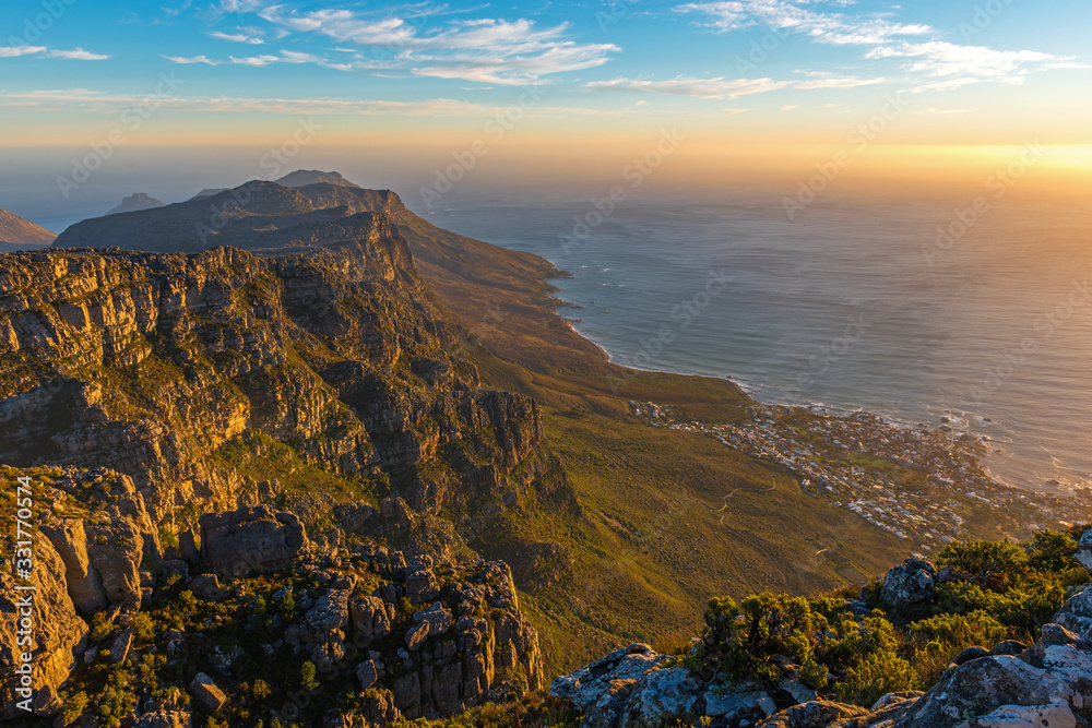 The Indian Ocean and Cape Town as seen from the Table Mountain National Park at sunset, Western Cape Province, South Africa.