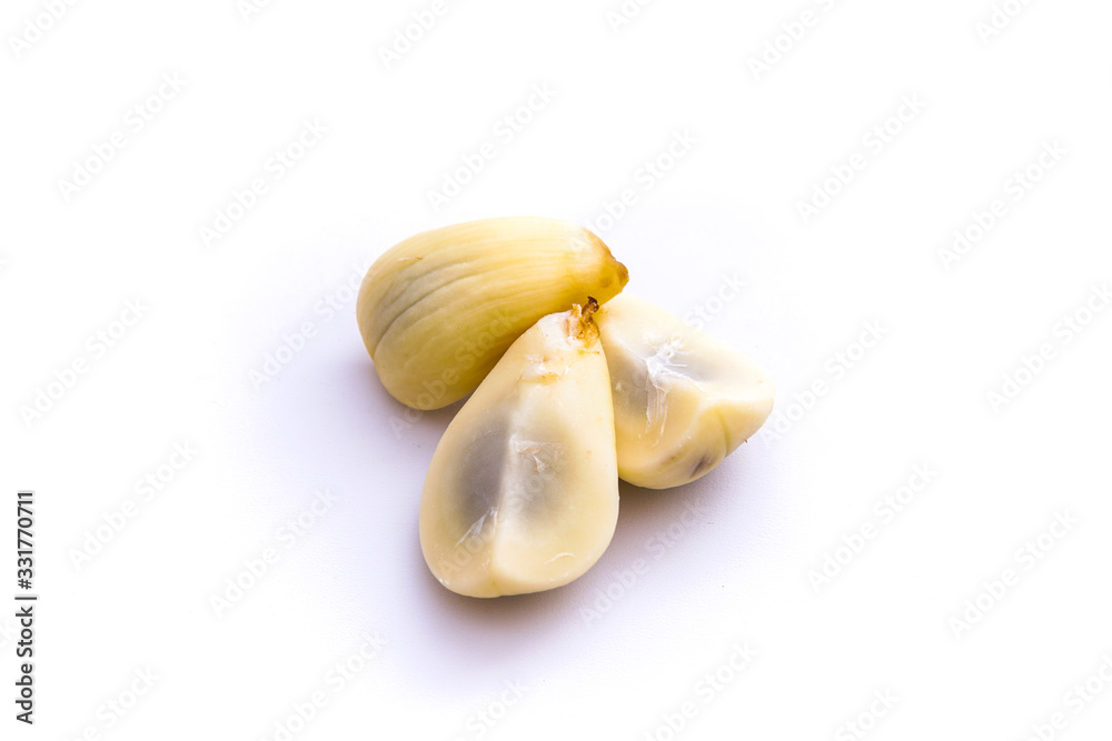 peeled salacca or thorny palm, isolated white background and copy space, scientific name: Salacca zalacca