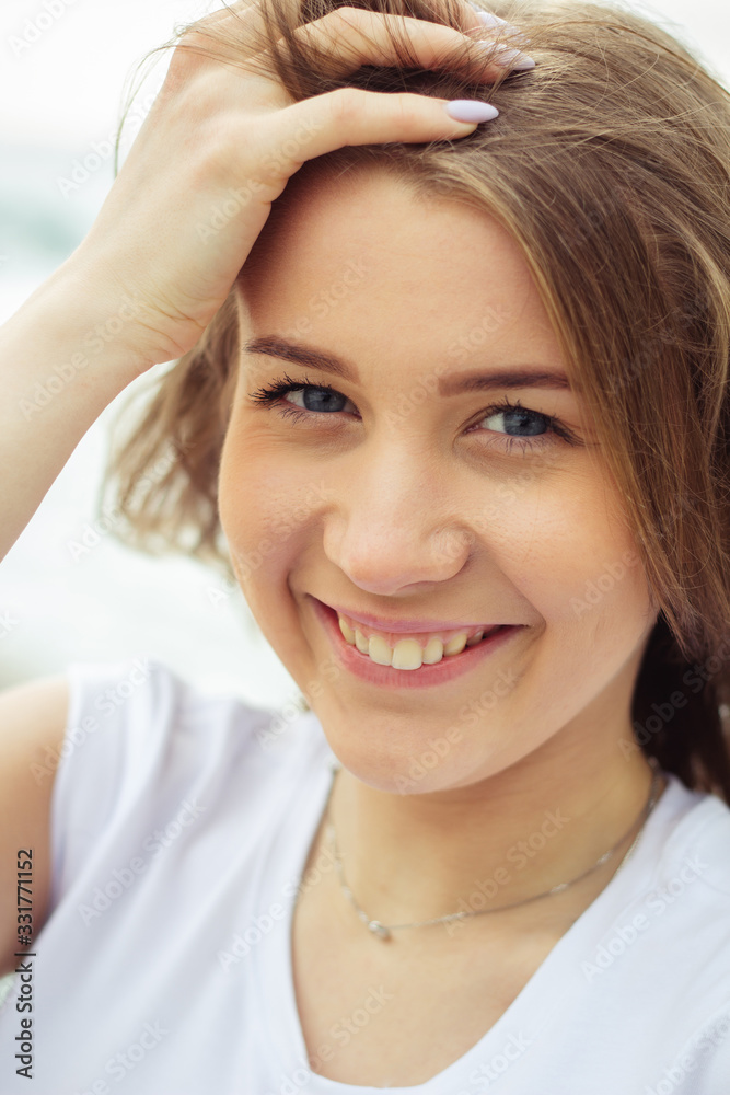 Portrait of smiling young woman who looking at camera Portrait of smiling young woman who looking at camera