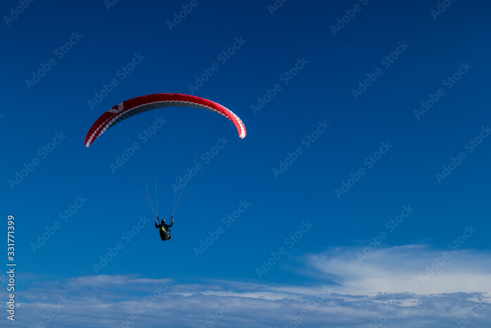 paragliding fly above the clouds in the blue sky paragliding fly above the clouds in the blue sky