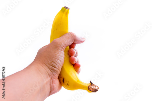 Yellow ripe bananas in the hand, white background isolated and copy space