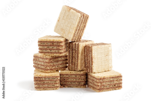 Heap of square wafer biscuits isolated on white