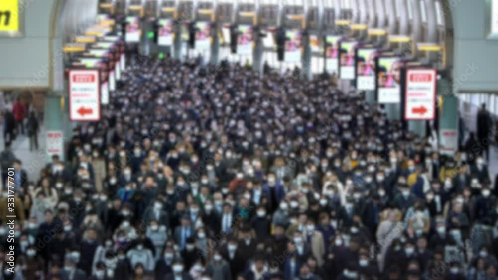 4K, Blurred defocused view of Aerial of people at Shinagawa Station. Japanese business men and women walk to work. Passengers walked of world's busiest transport hub with daily usage.-Dan