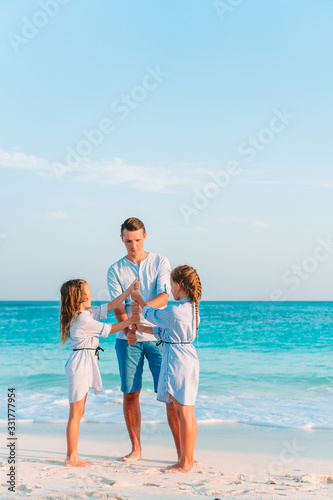 Happy beautiful family on a tropical beach vacation