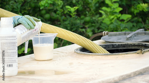 Spray pesticides, pesticide on fruit lemon in growing agricultural plantation, spain. Man spraying or fumigating pesti, pest control. Weed insecticide fumigation. Organic ecological agriculture.