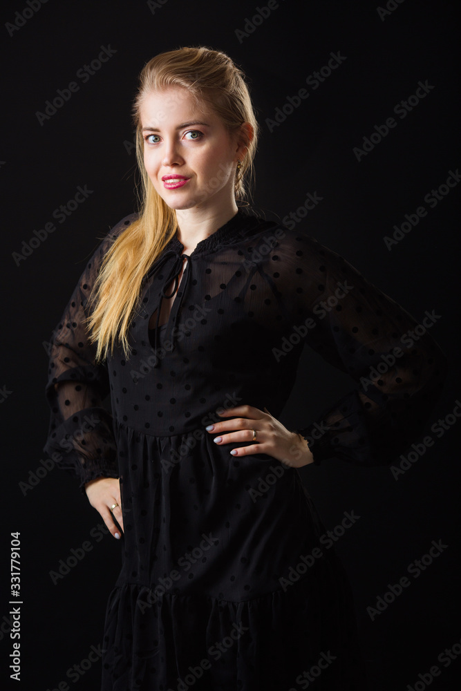 beautiful young woman with makeup and her hair on a black background beautiful young woman with makeup and her hair on a black background