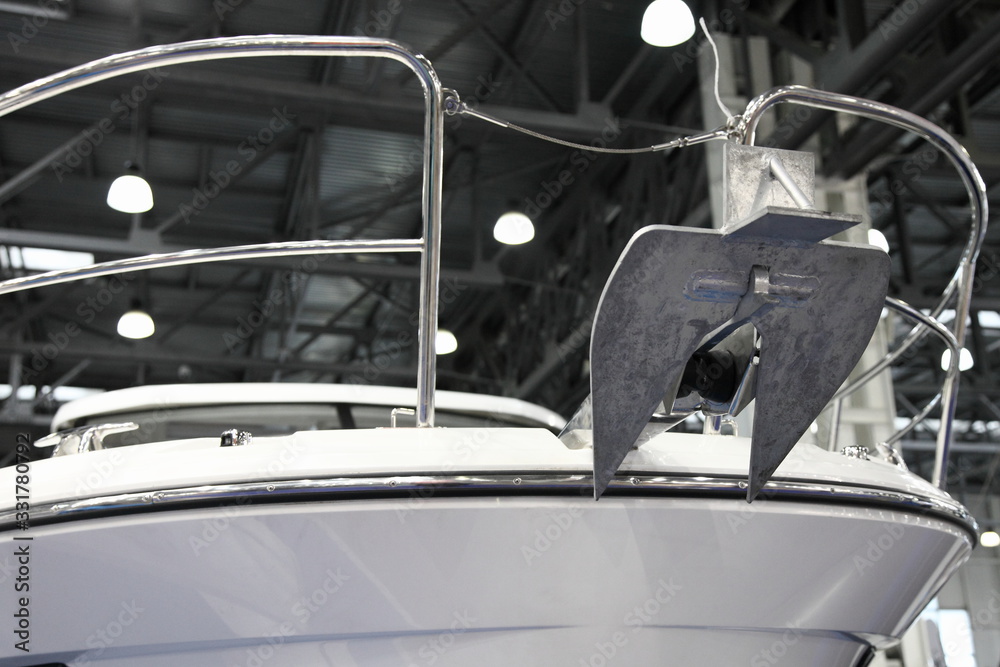 Fototapeta premium Denfort type anchor on bow of a motor yacht close up
