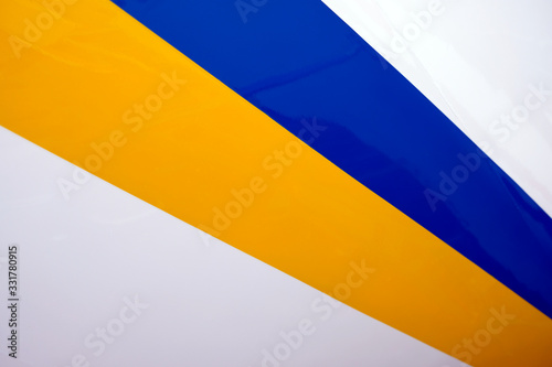 Radial white, yellow and blue bands in perspective.