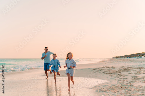 Happy beautiful family on a tropical beach vacation