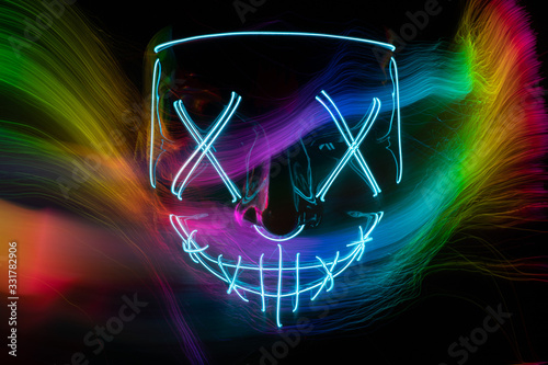 Neon blue glow mask in the dark