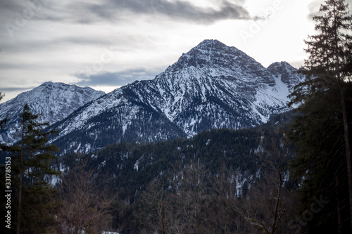 High alpine mountains with snow in Germany and blue beautiful sky