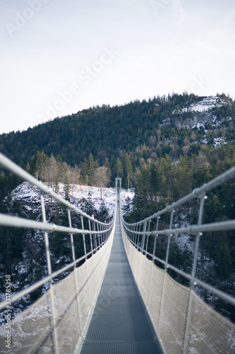 Fototapeta Naklejka Na Ścianę i Meble -  Suspension bridge between the mountains in the Alps in Germany