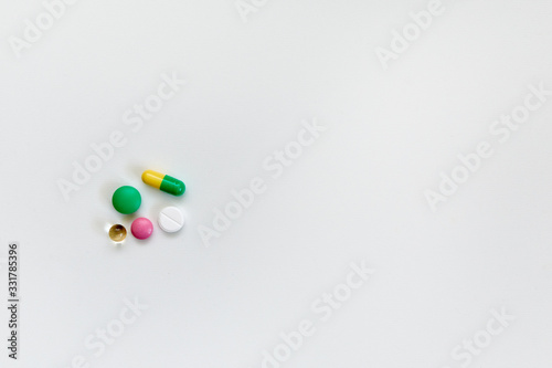 pills and medicines lie on a white background