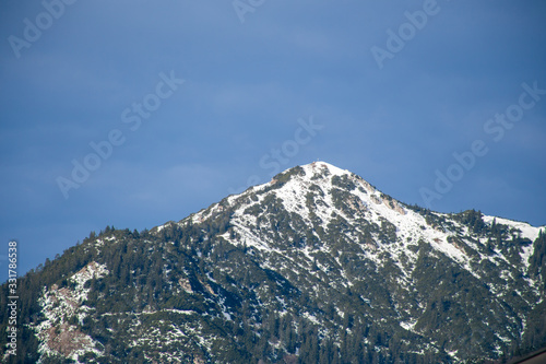 High alpine mountains with snow in Germany and blue beautiful sky