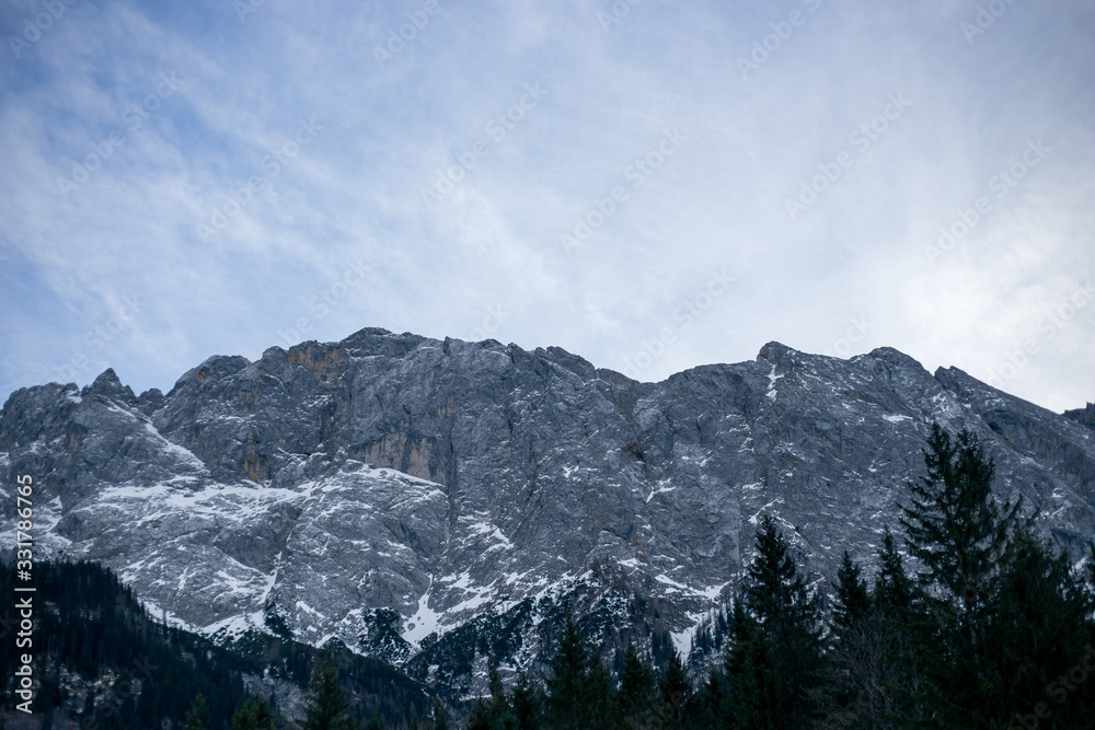 High alpine mountains with snow in Germany and blue beautiful sky