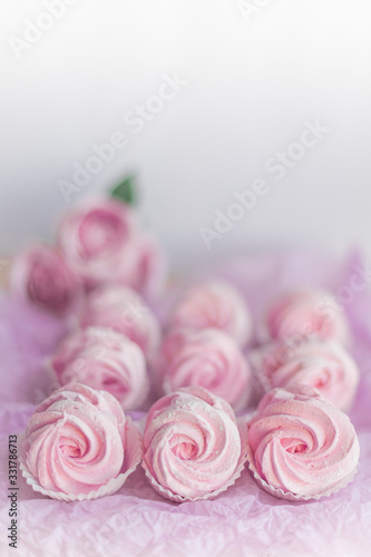 Homemade pink marshmallows on pastel pink background. Creative concept Marshmallow, Meringue. Homemade Sweets dessert © Iryna