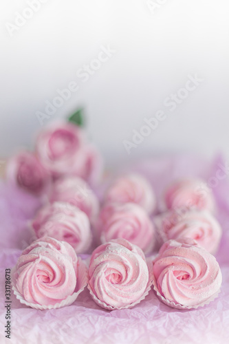 Homemade pink marshmallows on pastel pink background. Creative concept Marshmallow, Meringue. Homemade Sweets dessert