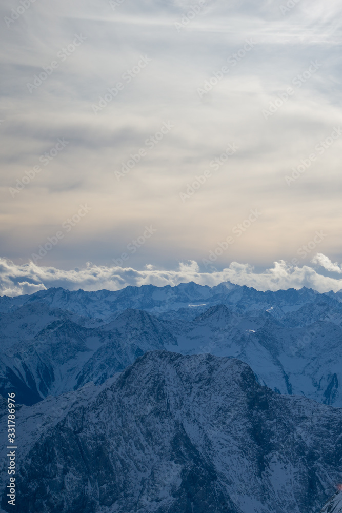 High alpine mountains with snow in Germany and blue beautiful sky