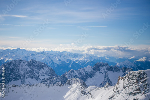 High alpine mountains with snow in Germany and blue beautiful sky © Hennadii