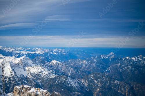 High alpine mountains with snow in Germany and blue beautiful sky