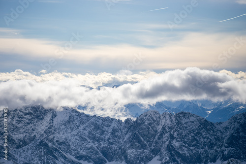 High alpine mountains with snow in Germany and blue beautiful sky