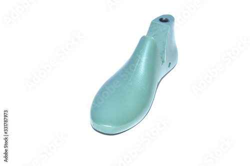 Plastic lasts (pads) used in the manufacture of shoes. Row of plastic shoe lasts used to manufacture modern day shoes. The equipment used for shoe design