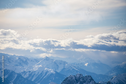 High alpine mountains with snow in Germany and blue beautiful sky © Hennadii