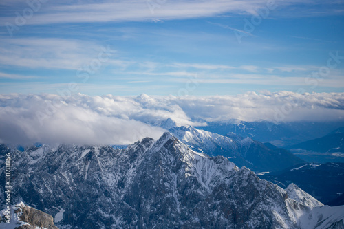 High alpine mountains with snow in Germany and blue beautiful sky