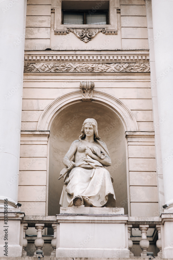Obraz premium The sculpture muse of tragedy on the facade of the Opera and Ballet Theater in Lviv. Neoclassicism in architecture.