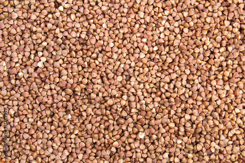 Natural texture or background with buckwheat. Closeup. Top view. Copy space.
