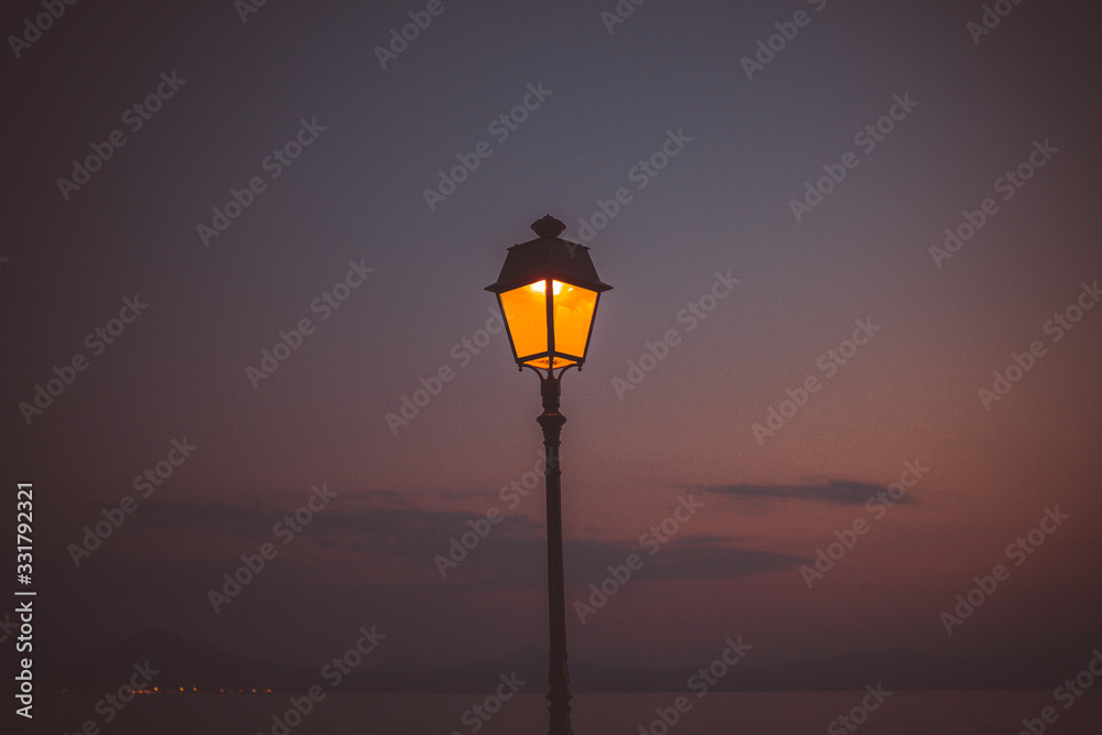 Evening sunset at the Greece. Lighting inside Lantern shining. Background picture.