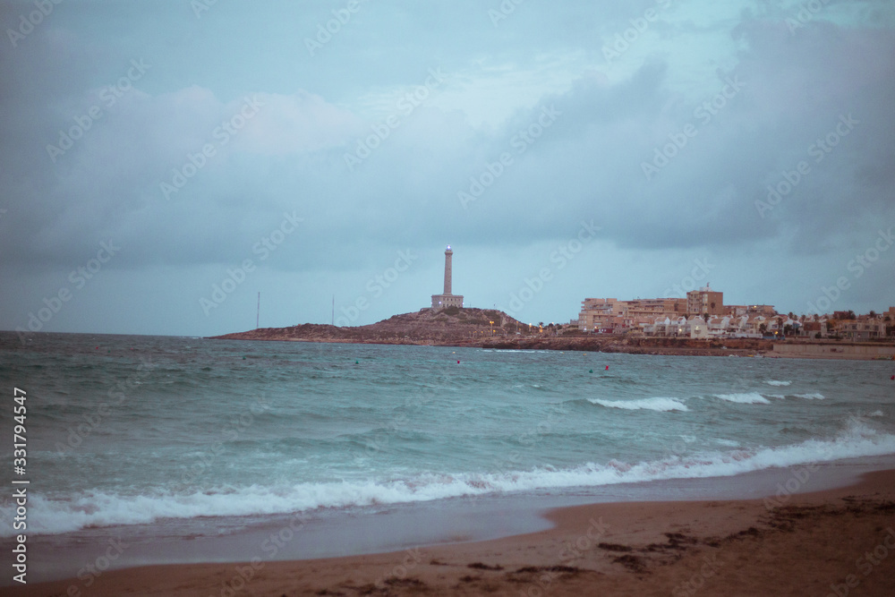 Beachfront lighthouse in Murcia on the Mediterranean Sea on the beach