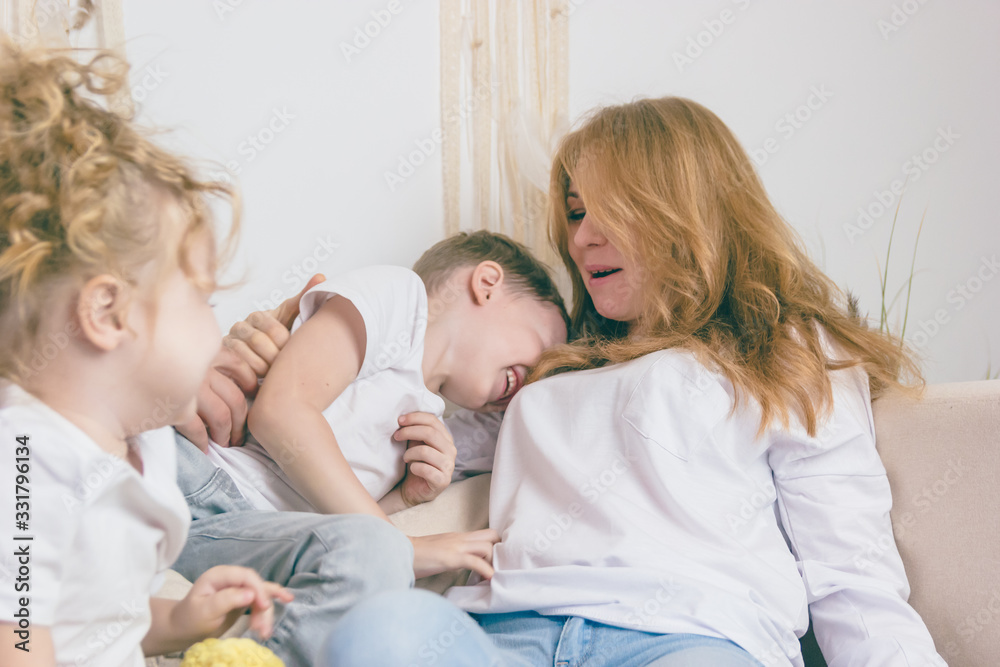 A loving woman with children. Happy family. A loving woman with children. Happy family.