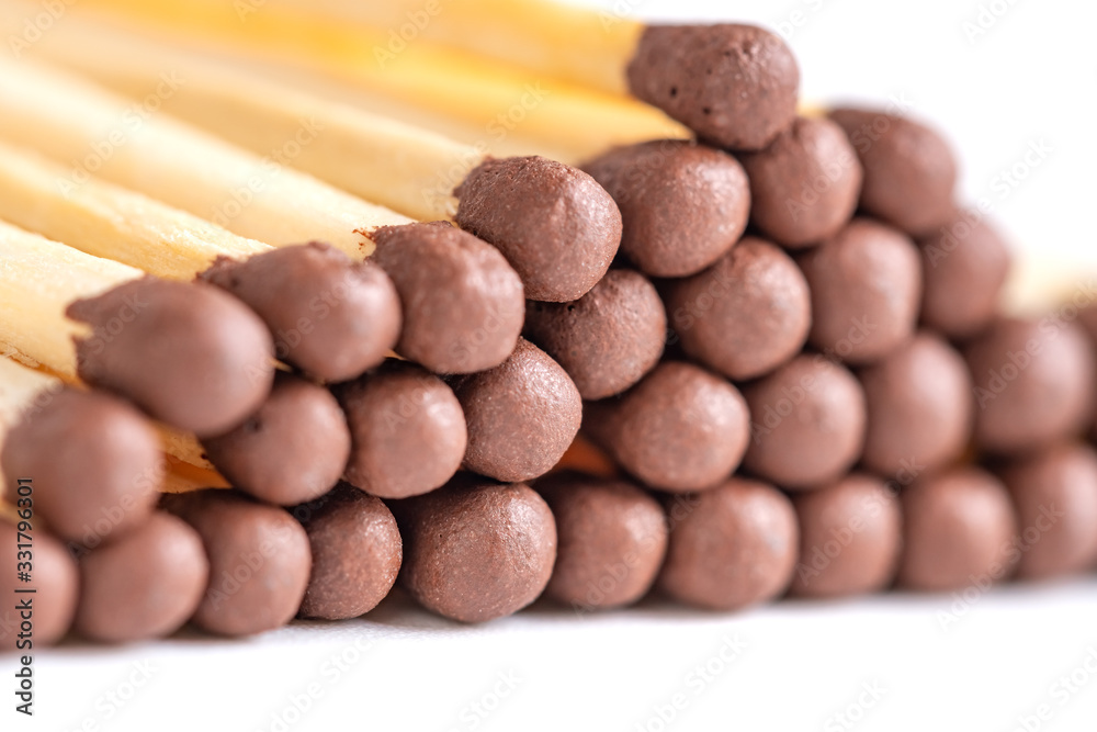Wooden matches with sulfur for lighting a fire isolated on a white background Wooden matches with sulfur for lighting a fire isolated on a white background