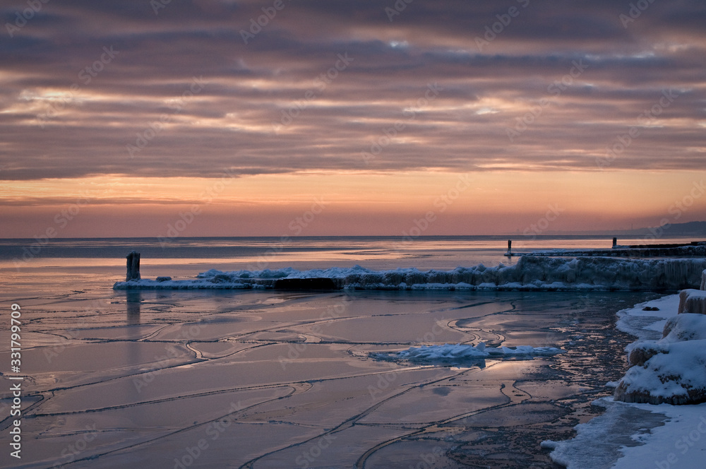 The Lake Michigan shoreline at dawn on a winter morning at Openlands Lakeshore Preserve. The Lake Michigan shoreline at dawn on a winter morning at Openlands Lakeshore Preserve.