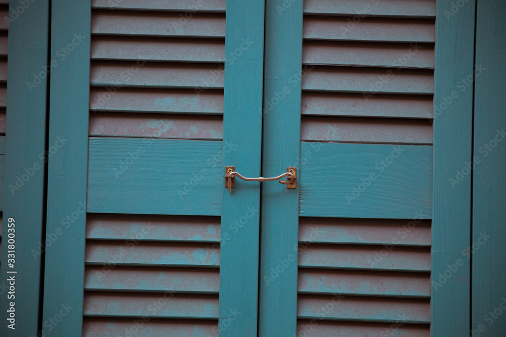 Blue louvred door with metal latch Blue louvred door with metal latch