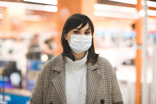 Asian woman wearing medical mask walking in mall shopping indoors alone. Virus concept. Healthcare.