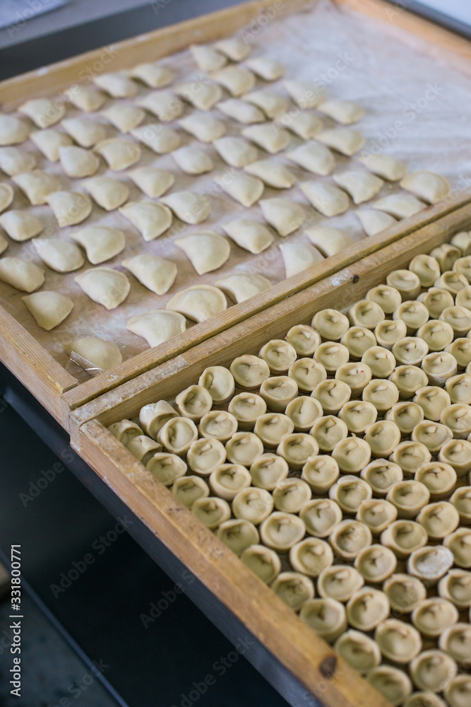 Russian raw meat dumplings. manual production Russian raw meat dumplings. manual production