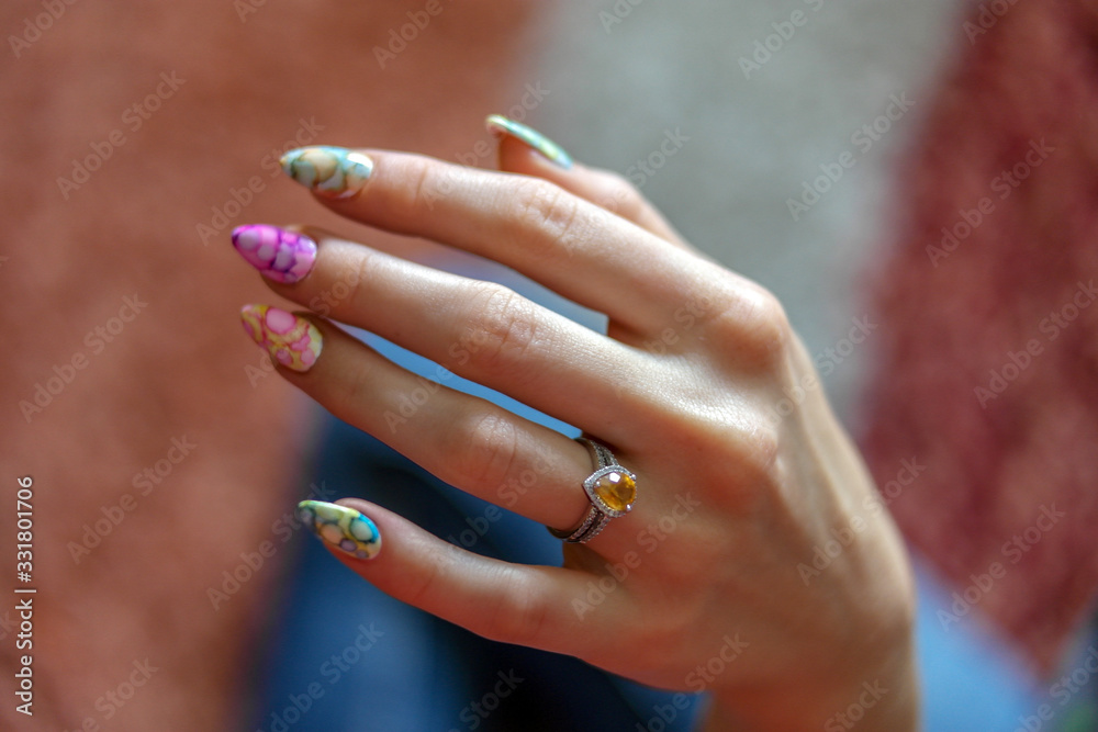 Woman hand with nice finger nail and ring with citrine stone, watercolor and colorful style, wth white golf and stirling silver jewelry Woman hand with nice finger nail and ring with citrine stone, watercolor and colorful style, wth white golf and stirling silver jewelry